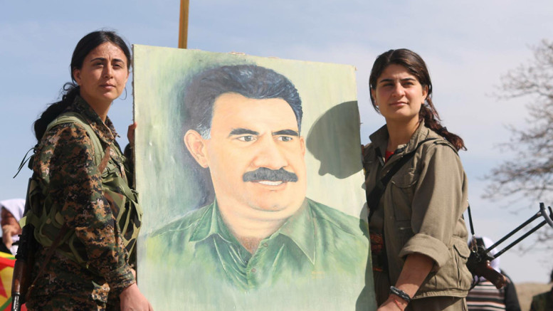 Sinjar Resistance - PKK hold up Ocalan portrait-777x437